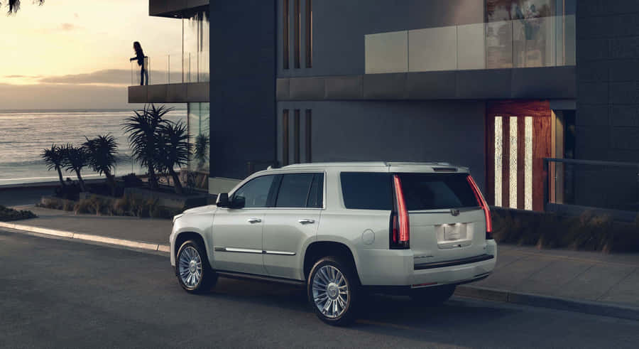 Sleek And Stylish Cadillac Escalade In Urban Setting Wallpaper