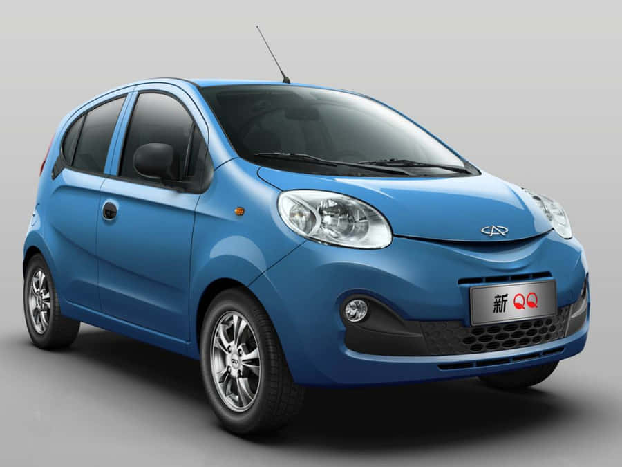 Sleek And Stylish Chery With A Majestic Mountain View Wallpaper