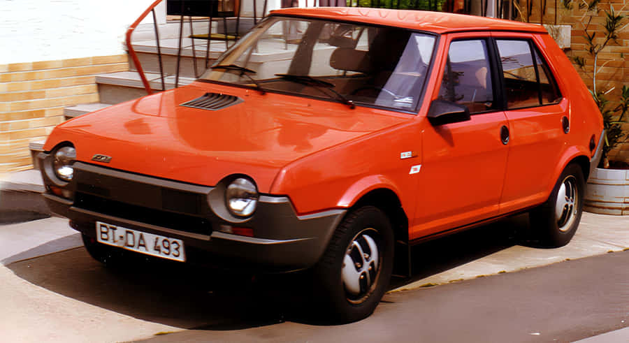 Sleek And Stylish Fiat Ritmo On The Road Wallpaper