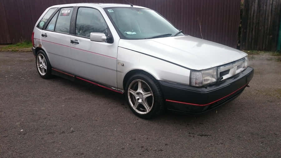 Sleek And Stylish Fiat Tipo On The Road Wallpaper