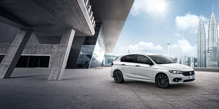 Sleek And Stylish Fiat Tipo On The Road Wallpaper