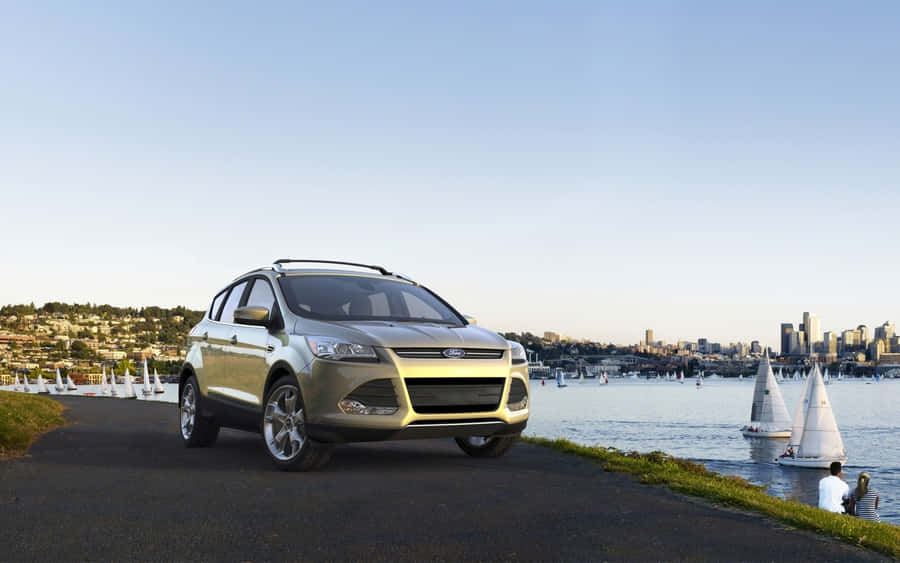 Sleek And Stylish Ford Escape On The Road Wallpaper