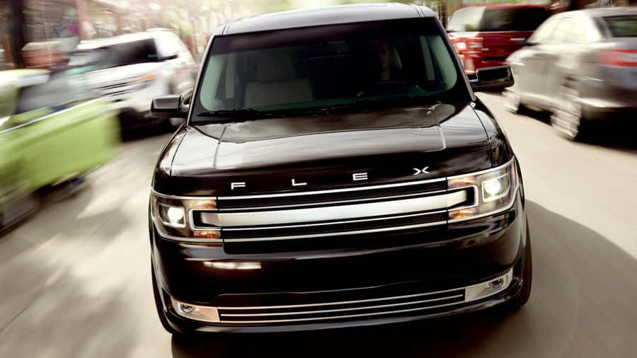 Sleek And Stylish Ford Flex On The Road Wallpaper