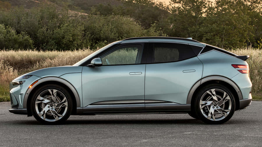 Sleek And Stylish Genesis Gv60 In Motion Wallpaper