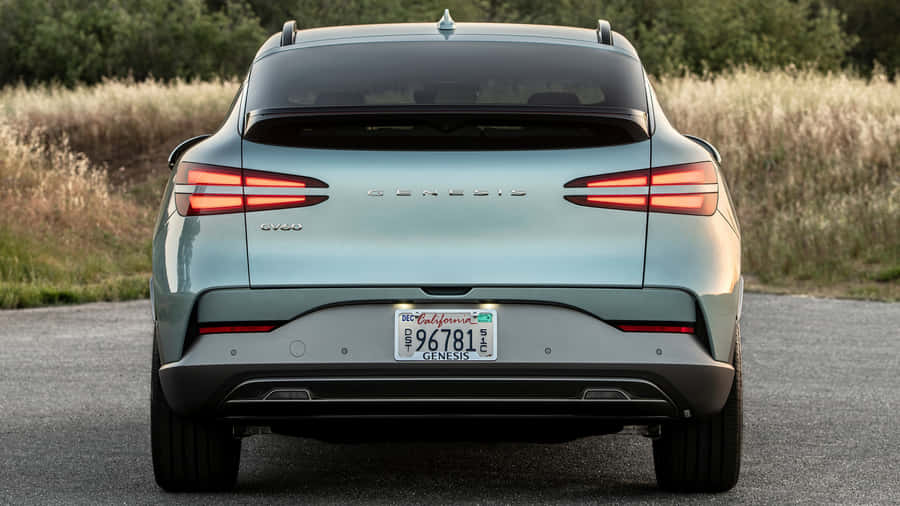 Sleek And Stylish Genesis Gv60 On The Road Wallpaper