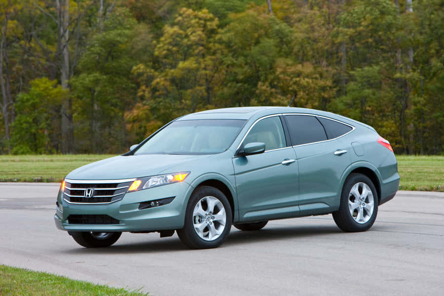 Sleek And Stylish Honda Crosstour On The Road Wallpaper