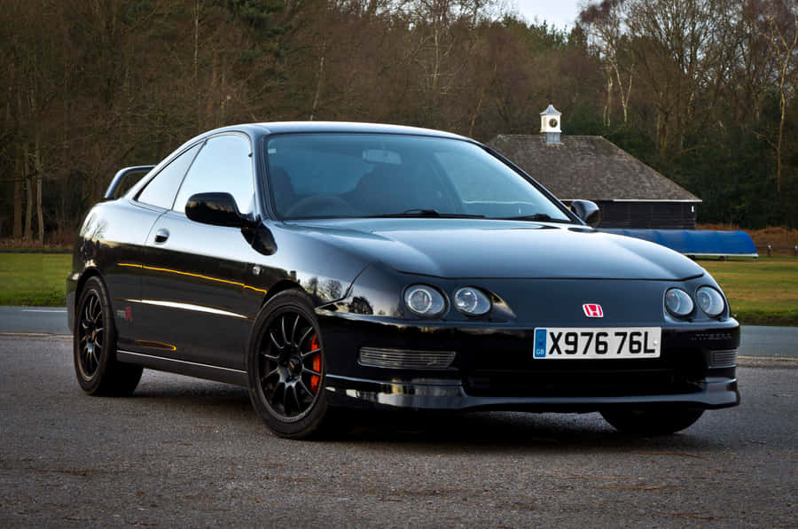 Sleek And Stylish Honda Integra In Its Natural Element Wallpaper