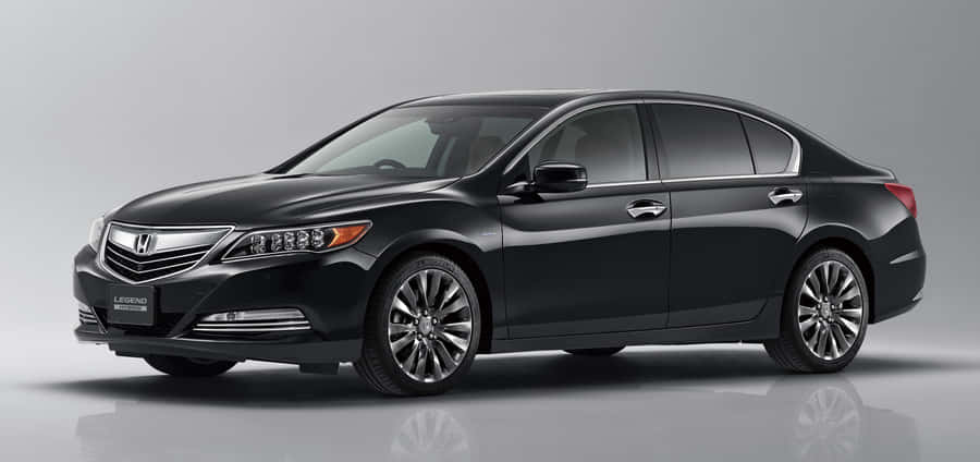 Sleek And Stylish Honda Legend On The Road Wallpaper
