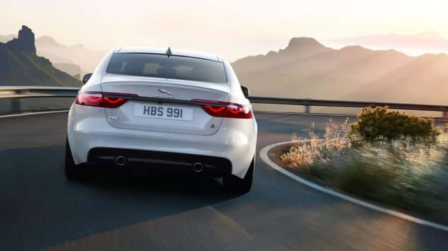 Sleek And Stylish Jaguar Xf Under The Lights Wallpaper