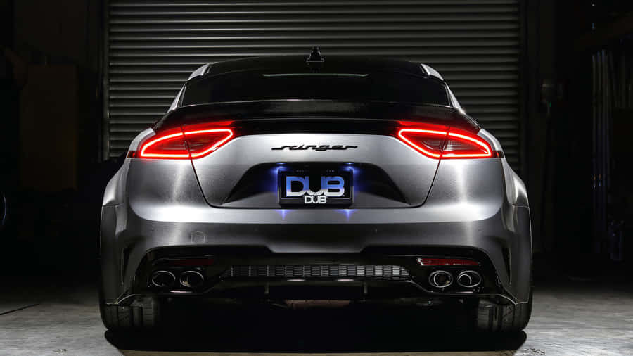 Sleek And Stylish Kia Stinger On The Road Wallpaper