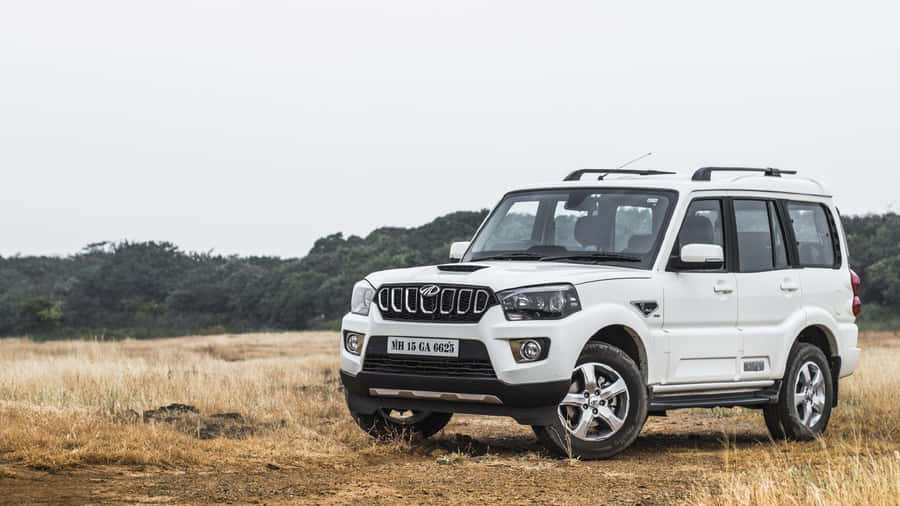 Sleek And Stylish Mahindra Suv On The Road Wallpaper