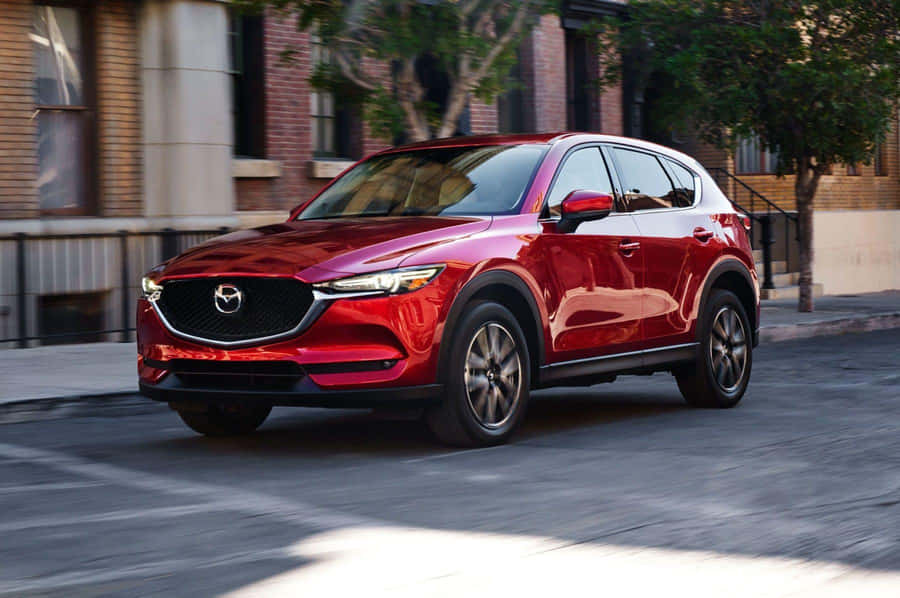 Sleek And Stylish Mazda Cx-5 On The Road Wallpaper