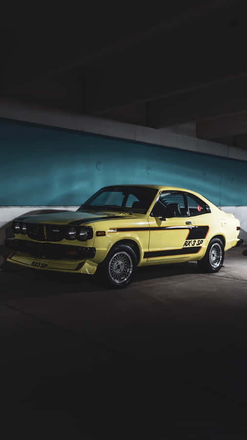 Sleek And Stylish Mazda Rx-3 On The Road Wallpaper