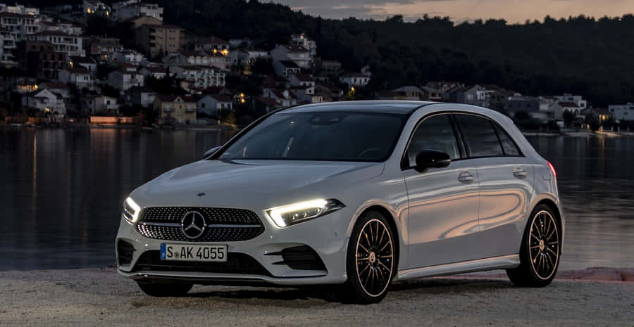 Sleek And Stylish Mercedes-benz A-class On The Road Wallpaper