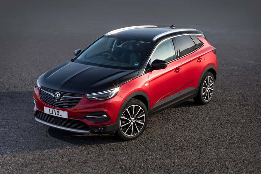 Sleek And Stylish Opel Grandland X On The Road Wallpaper