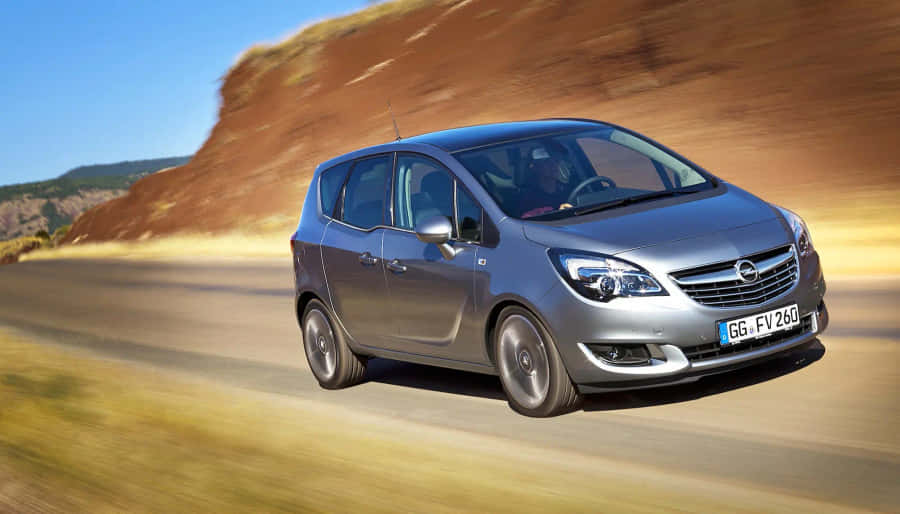 Sleek And Stylish Opel Meriva In Action Wallpaper