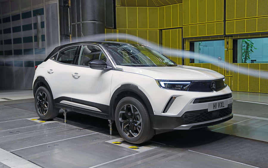 Sleek And Stylish Opel Mokka On The Road Wallpaper