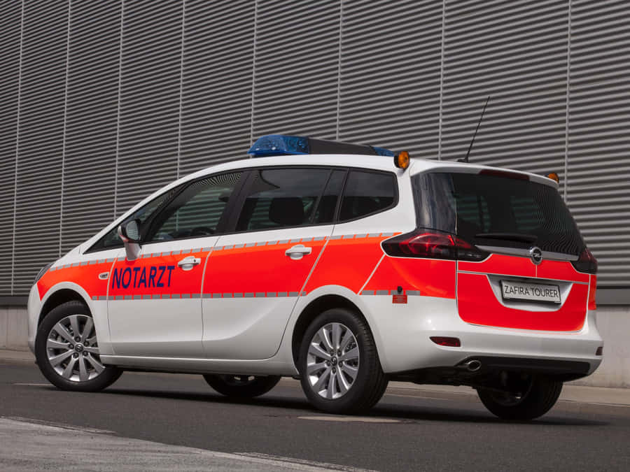 Sleek And Stylish Opel Zafira On The Road Wallpaper