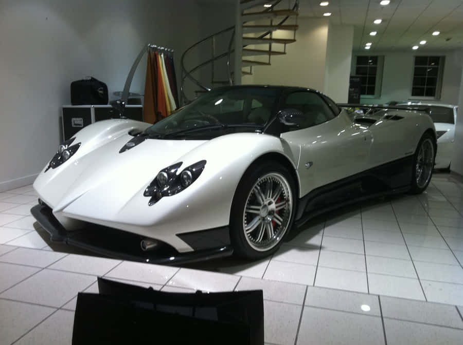 Sleek And Stylish Pagani Zonda C12 Roadster On The Open Road Wallpaper