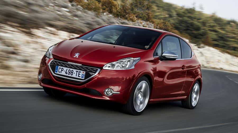 Sleek And Stylish Peugeot 208 In A Stunning Urban Environment Wallpaper