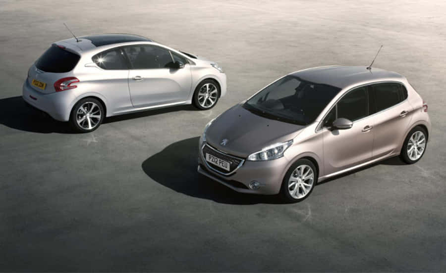 Sleek And Stylish Peugeot 208 In Action Wallpaper