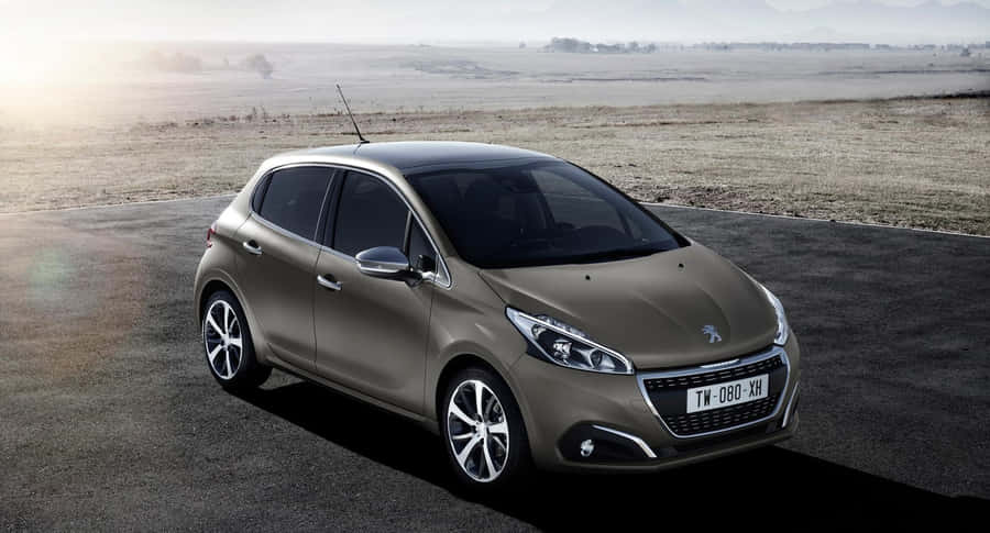 Sleek And Stylish Peugeot 208 On The Open Road Wallpaper