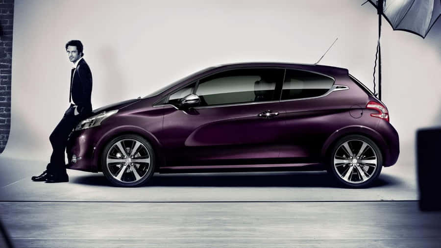 Sleek And Stylish Peugeot 208 On The Road Wallpaper