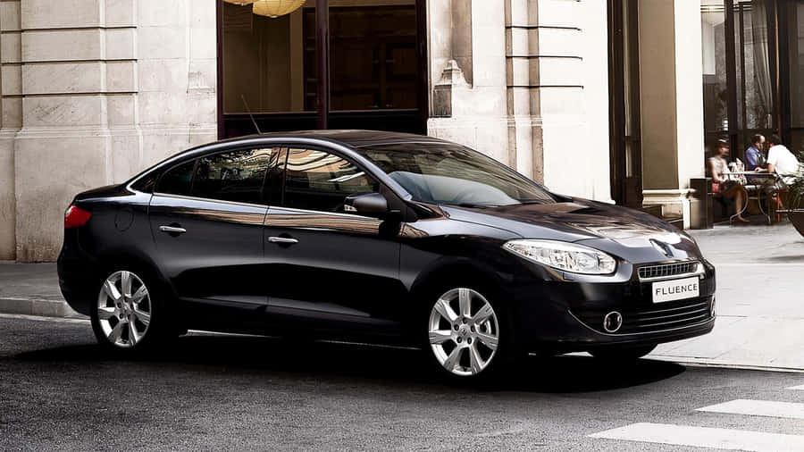 Sleek And Stylish Renault Fluence On The Road Wallpaper