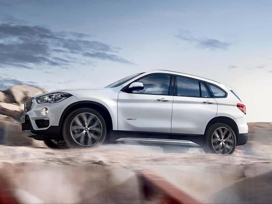 Sleek And Versatile Bmw X1 On The Road Wallpaper
