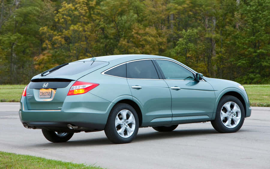 Sleek And Versatile Honda Crosstour On The Road Wallpaper