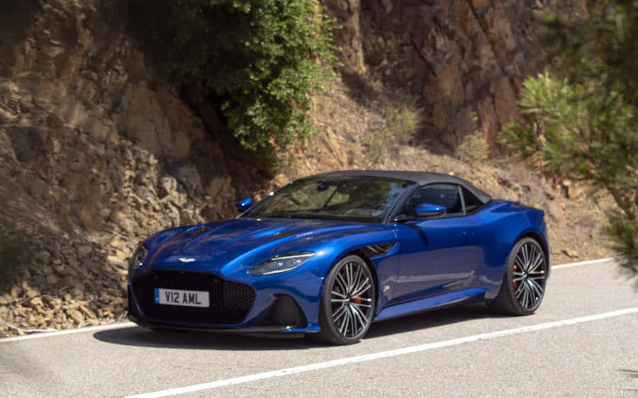 Sleek Aston Martin Dbs Superleggera On The Road Wallpaper