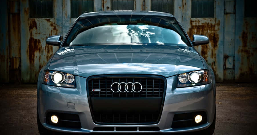 Sleek Audi A3 In A Majestic Landscape Wallpaper