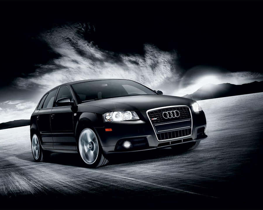 Sleek Audi A3 On A Scenic Drive Wallpaper