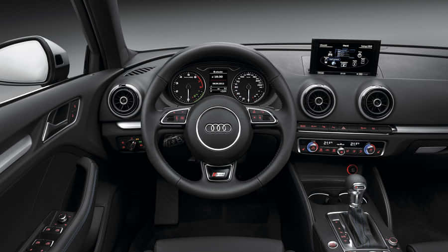 Sleek Audi A3 On The Open Road Wallpaper