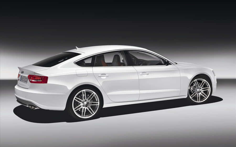 Sleek Audi A5 Sports Car In Action Wallpaper