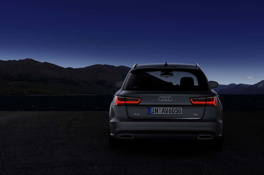 Sleek Audi A6 In Motion Wallpaper