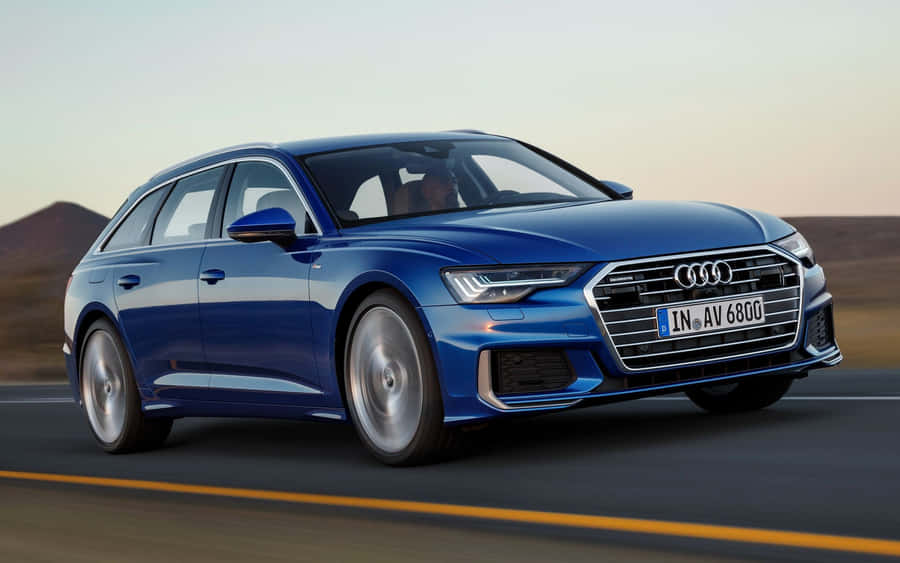 Sleek Audi A6 On The Road Wallpaper