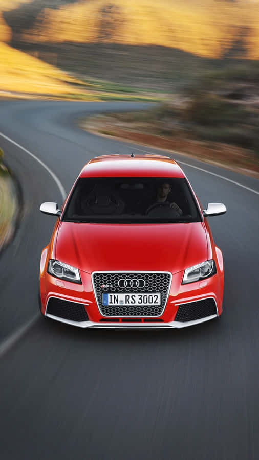 Sleek Audi Rs3 On A City Road Wallpaper