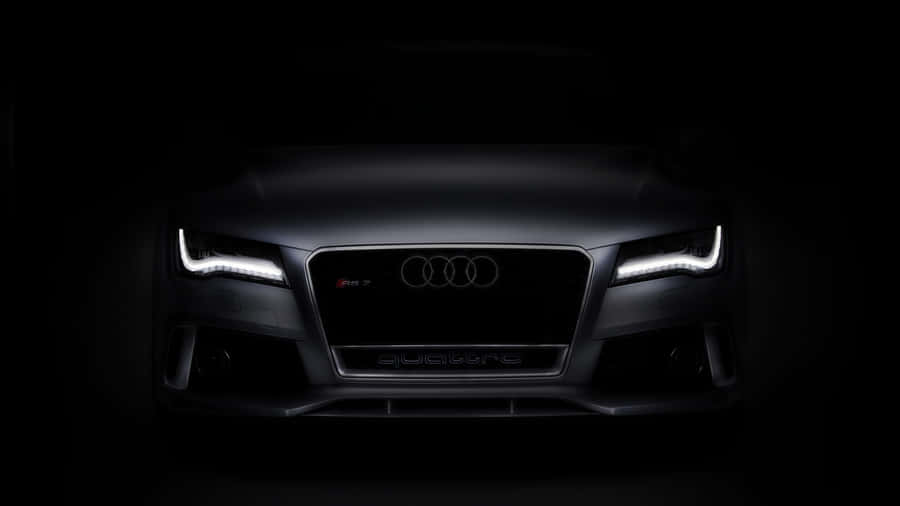 Sleek Audi S7 Driving Through The City Wallpaper