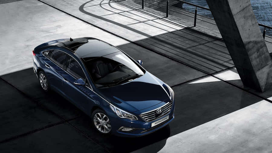 Sleek Black Hyundai Sonata In Nature Wallpaper