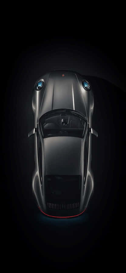 Sleek Black Porsche On The Go Wallpaper