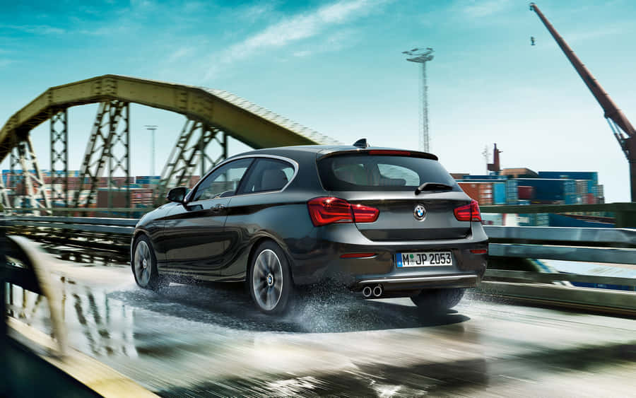 Sleek Bmw 1 Series On The Road Wallpaper