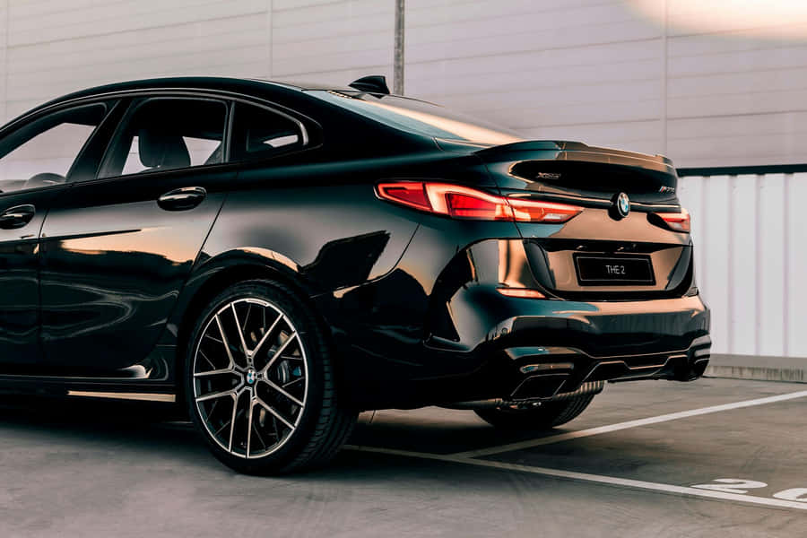 Sleek Bmw 2 Series Sports Car On The Road Wallpaper