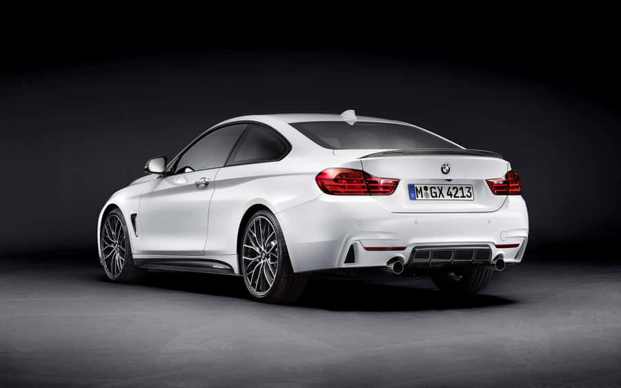 Sleek Bmw 4 Series Coupe In Action Wallpaper