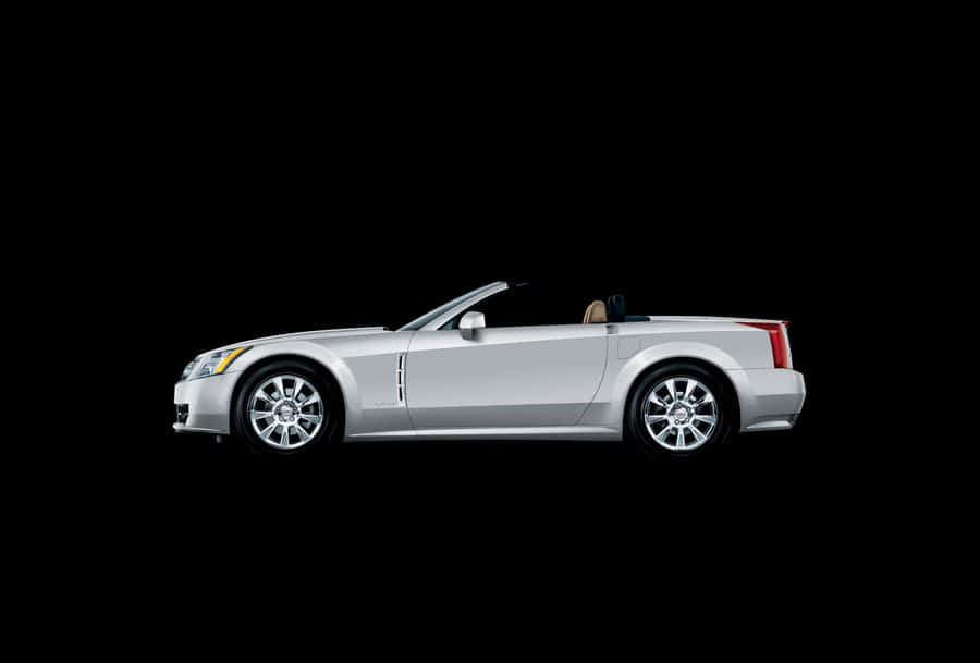 Sleek Cadillac Xlr On The Road Wallpaper