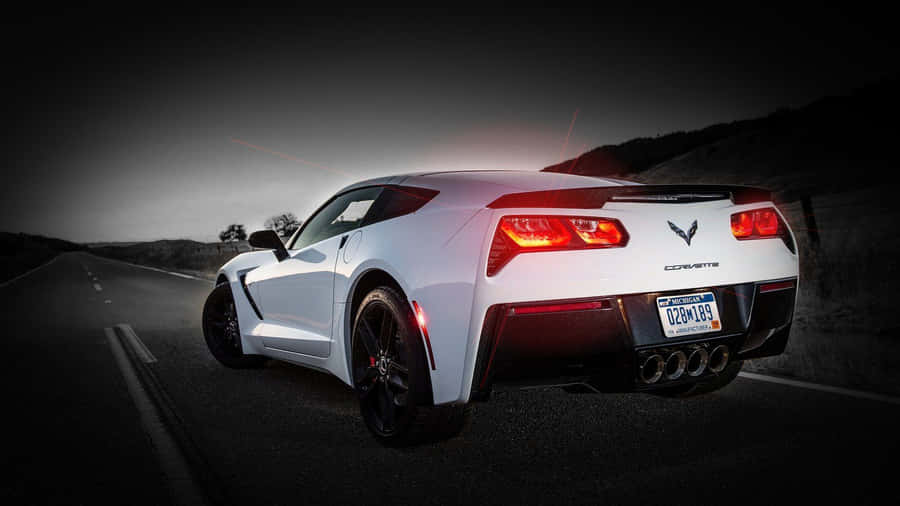 Sleek Chevrolet Corvette Stingray Cruising The Streets Wallpaper