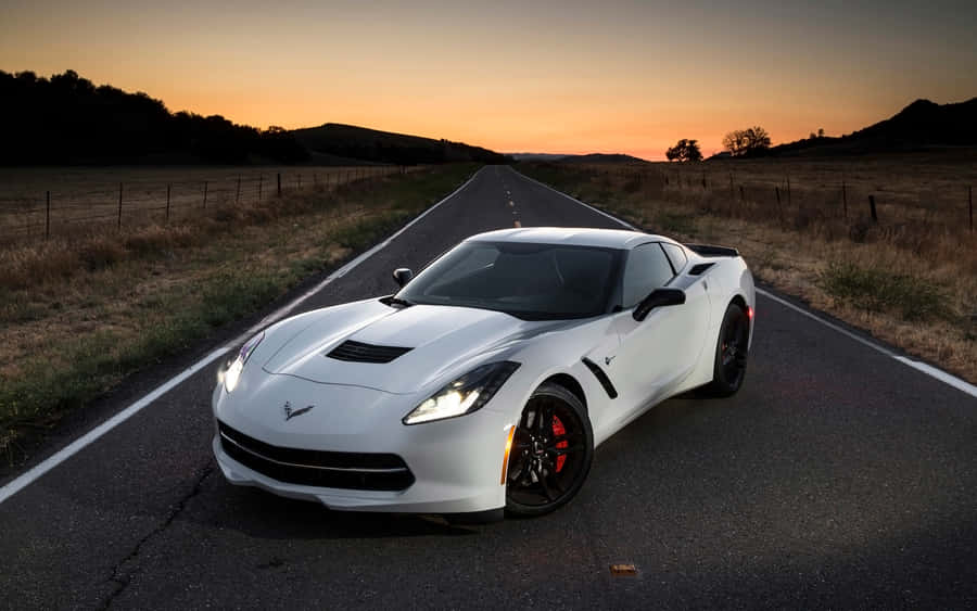 Sleek Chevrolet Corvette Stingray In Motion Wallpaper