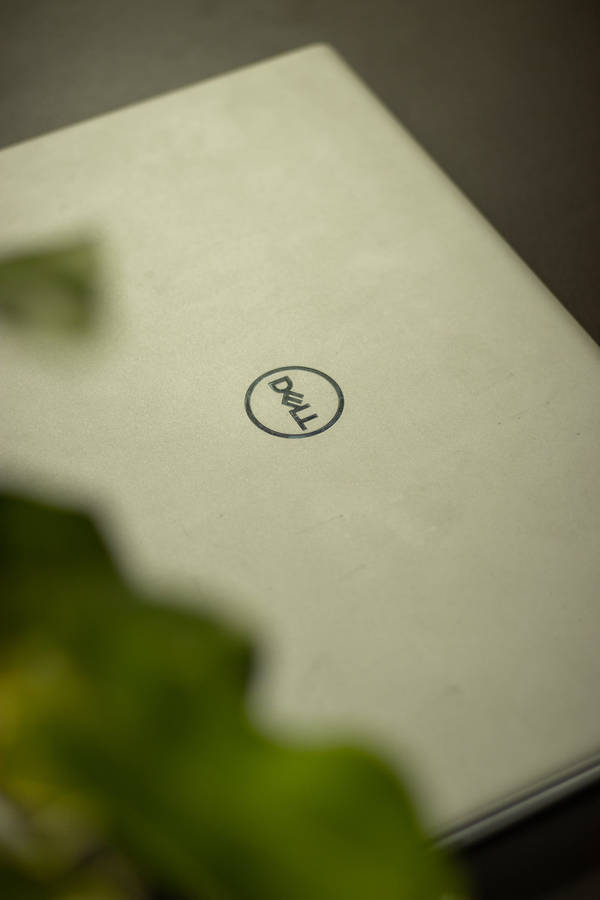 Sleek Dell Laptop Showcasing Excellence In Technology Wallpaper