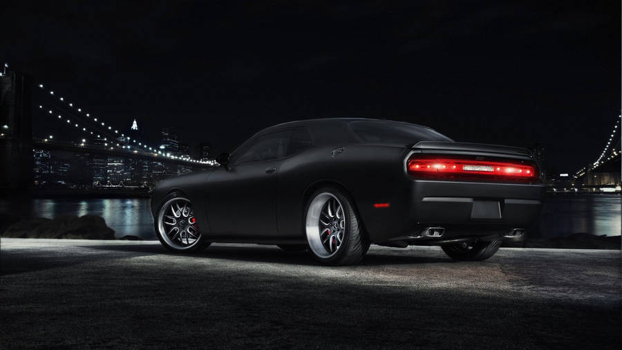Sleek Dodge Challenger In Pitch Black Wallpaper