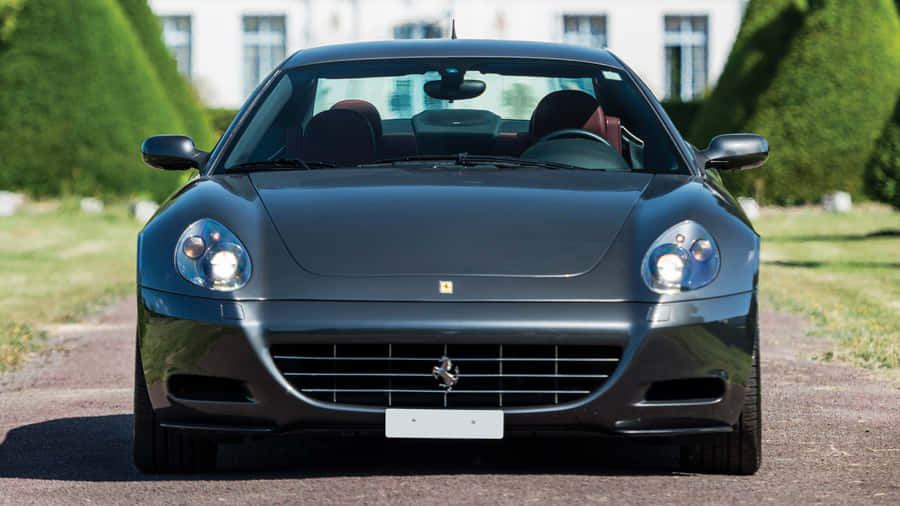 Sleek Ferrari 612 Scaglietti In A Stunning Landscape Wallpaper
